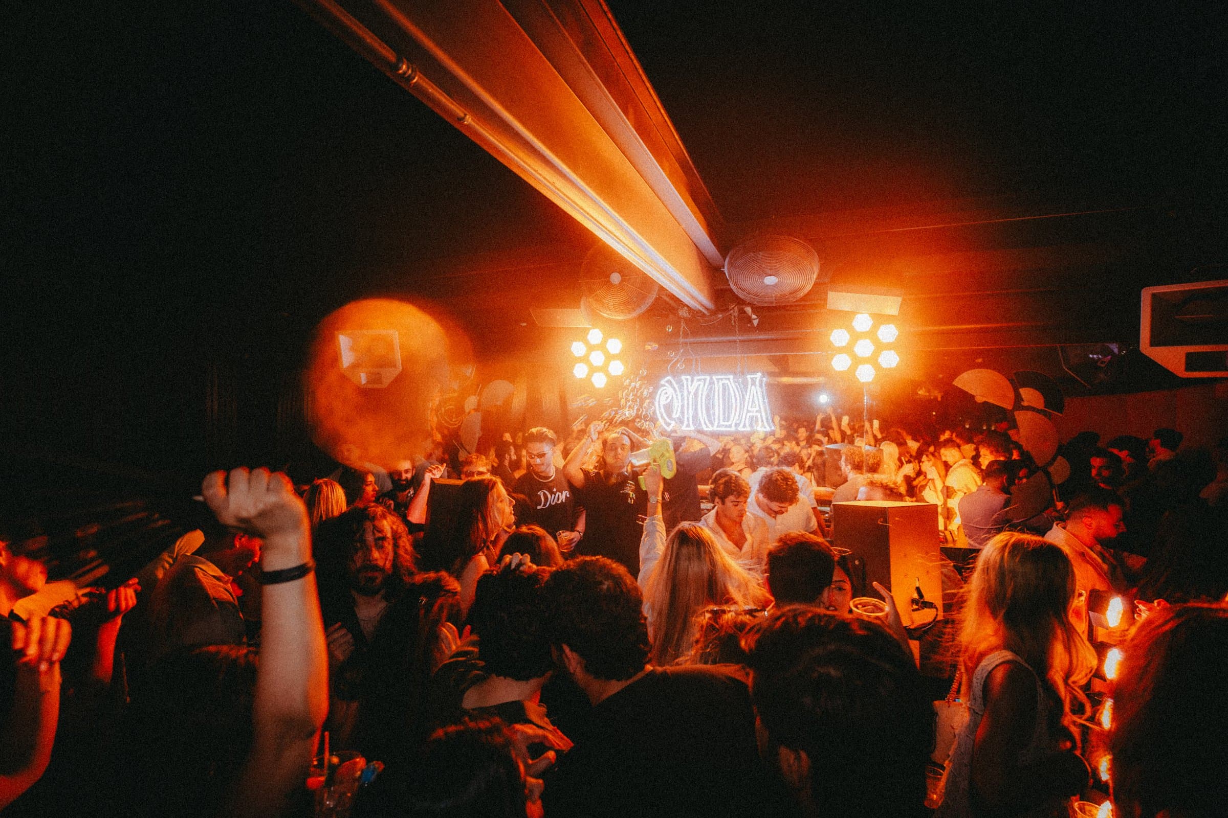 ONDA dance floor in warm orange light